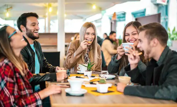 Friends enjoying coffee together at a café